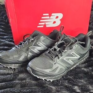 New Balance Black Athletic Shoes with Mesh Upper and Rugged Soles